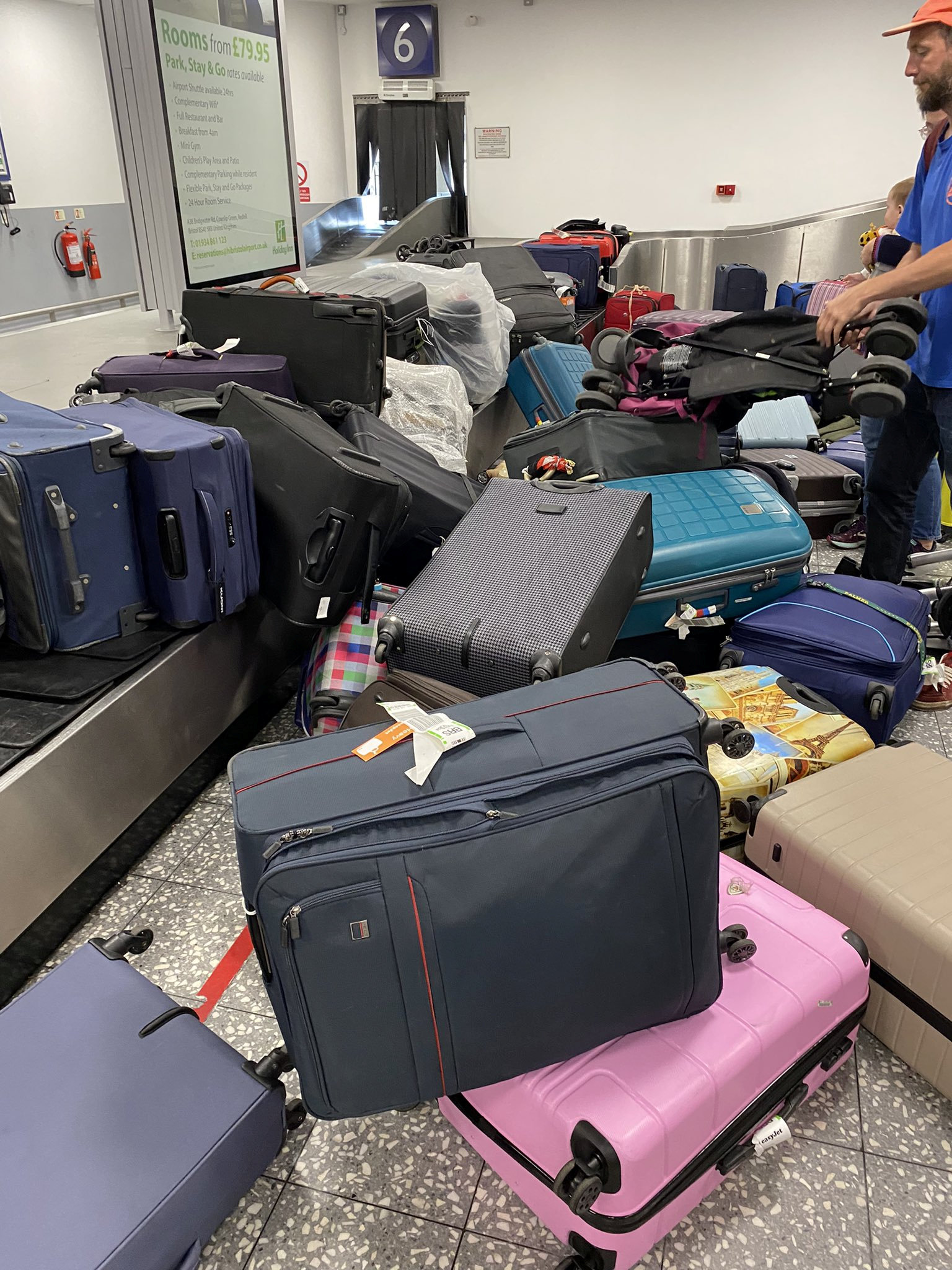 Suitcases pictured piled up at Bristol Airport amid staffing issue