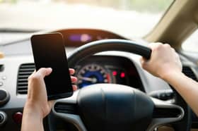 Drivers could be fined if they are caught using a mobile phone while behind the wheel